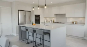 Modern kitchen renovation near me with sleek cabinetry, island, and stainless steel appliances.